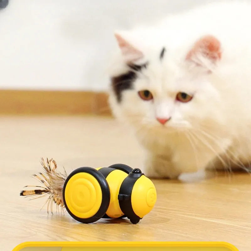 Bee-shaped electric cat car toy with feather teaser stick in pink and yellow colour options