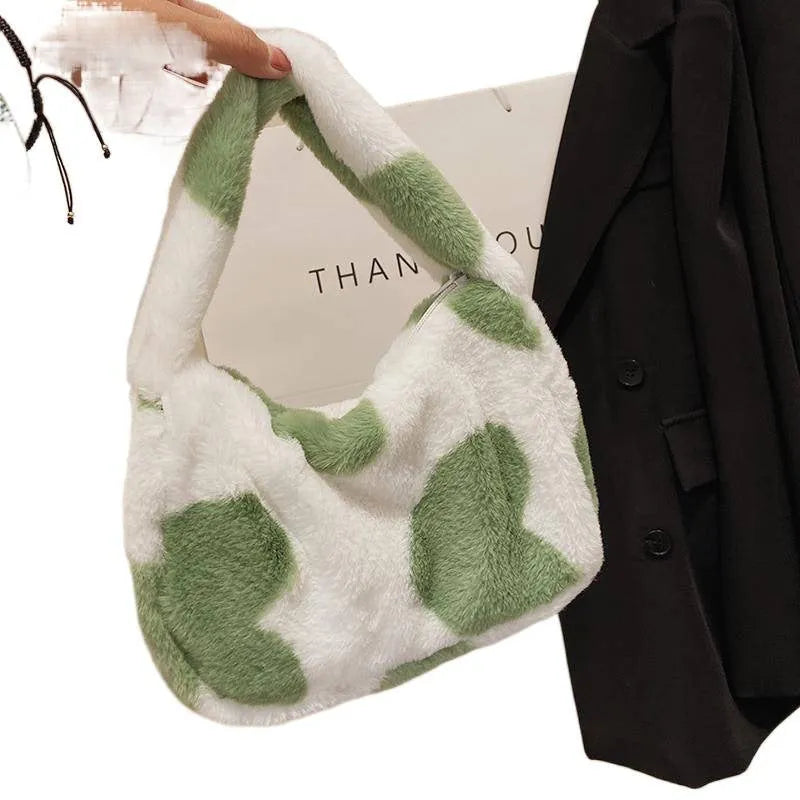 Velvet plush crossbody bag with contrast love heart detail, available in green, pink, black, and beige.