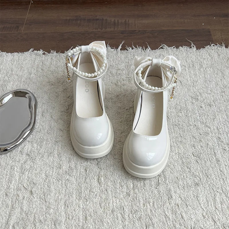 Beige women's Mary Jane pumps with a chunky 6cm heel and rounded toe on a white background.