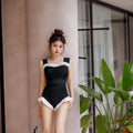 Korean-style high-waist one-piece swimsuit in black, pink, or green on a model