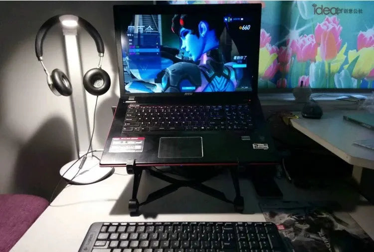 Black K2 portable foldable laptop stand made of enhanced nylon with carry bag.
