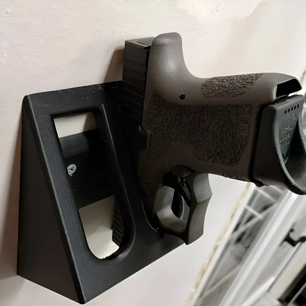 Black plastic punk-style pistol display stand for toy guns.