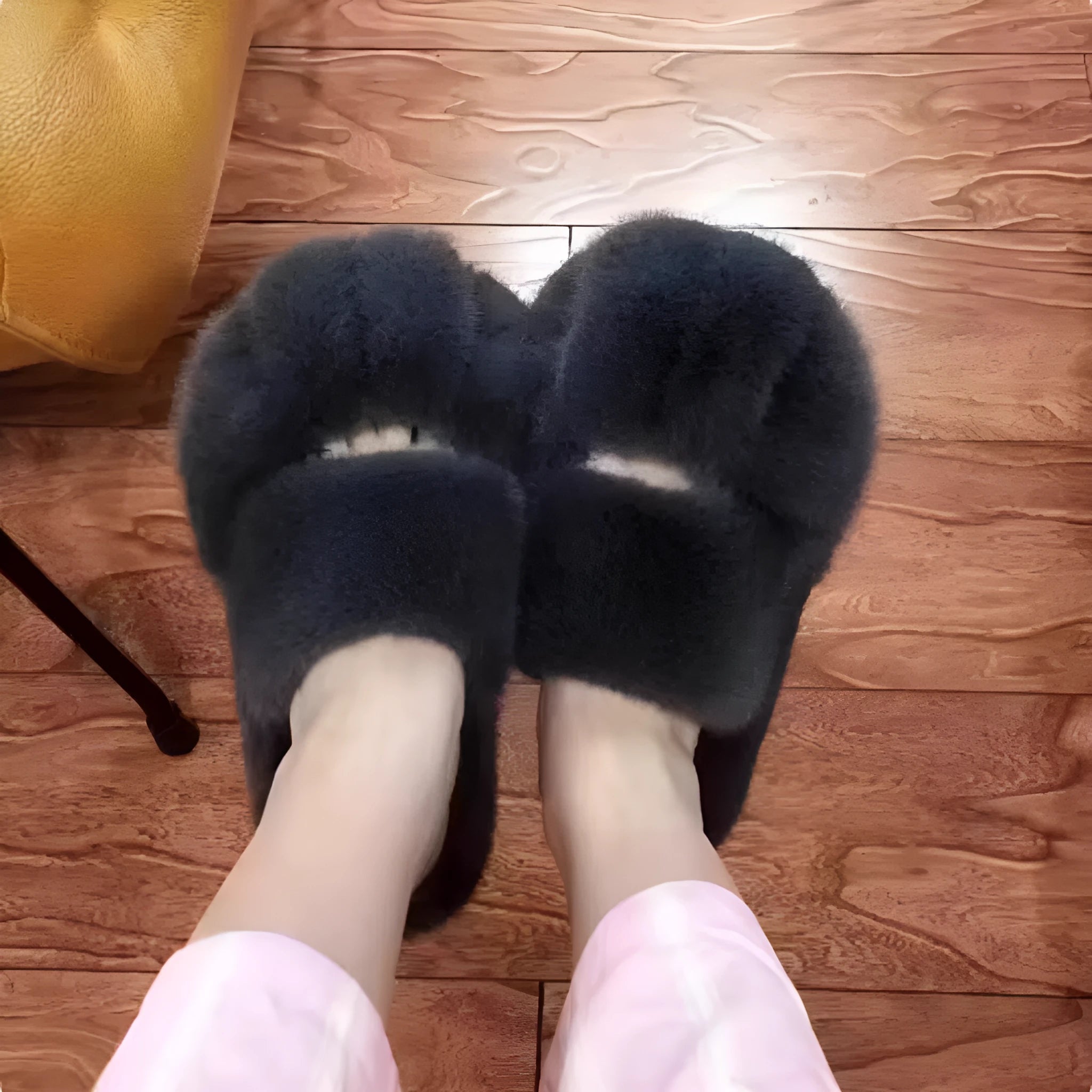 Cat paw fleece-lined slippers in yellow with non-slip sole on a floor
