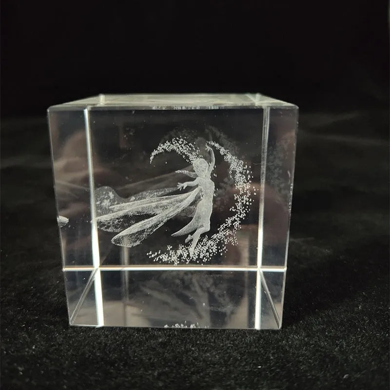 White crystal square ornament with engraved lotus design on a desk surface