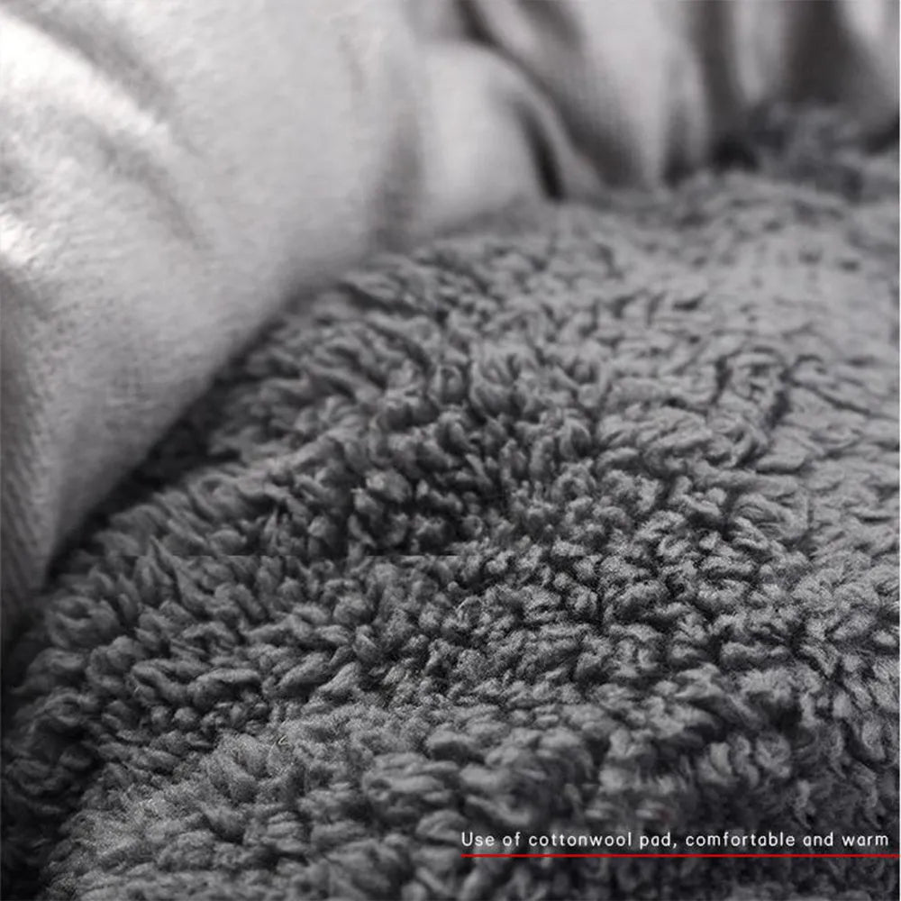 Grey round plush pet bed with a raised rim and non-slip base for small dogs and cats.