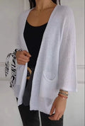 Women's waffle texture cardigan coat with nine-quarter sleeves shown in army green colour.