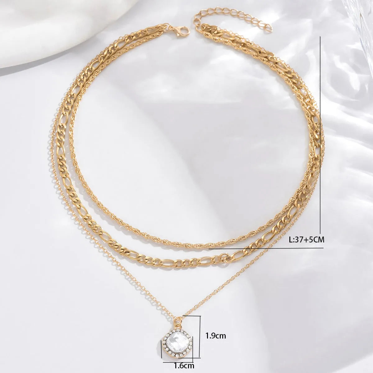 Gold multi-layer pendant necklace with large hemp flowers chain and round geometric pendants on alloy base