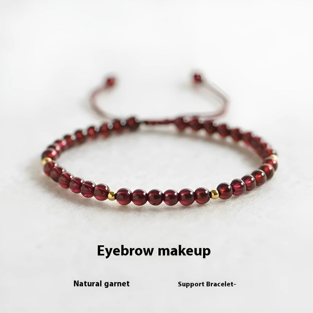 Hand-woven garnet red rope bracelet made from flexible wire, showing national tide style.