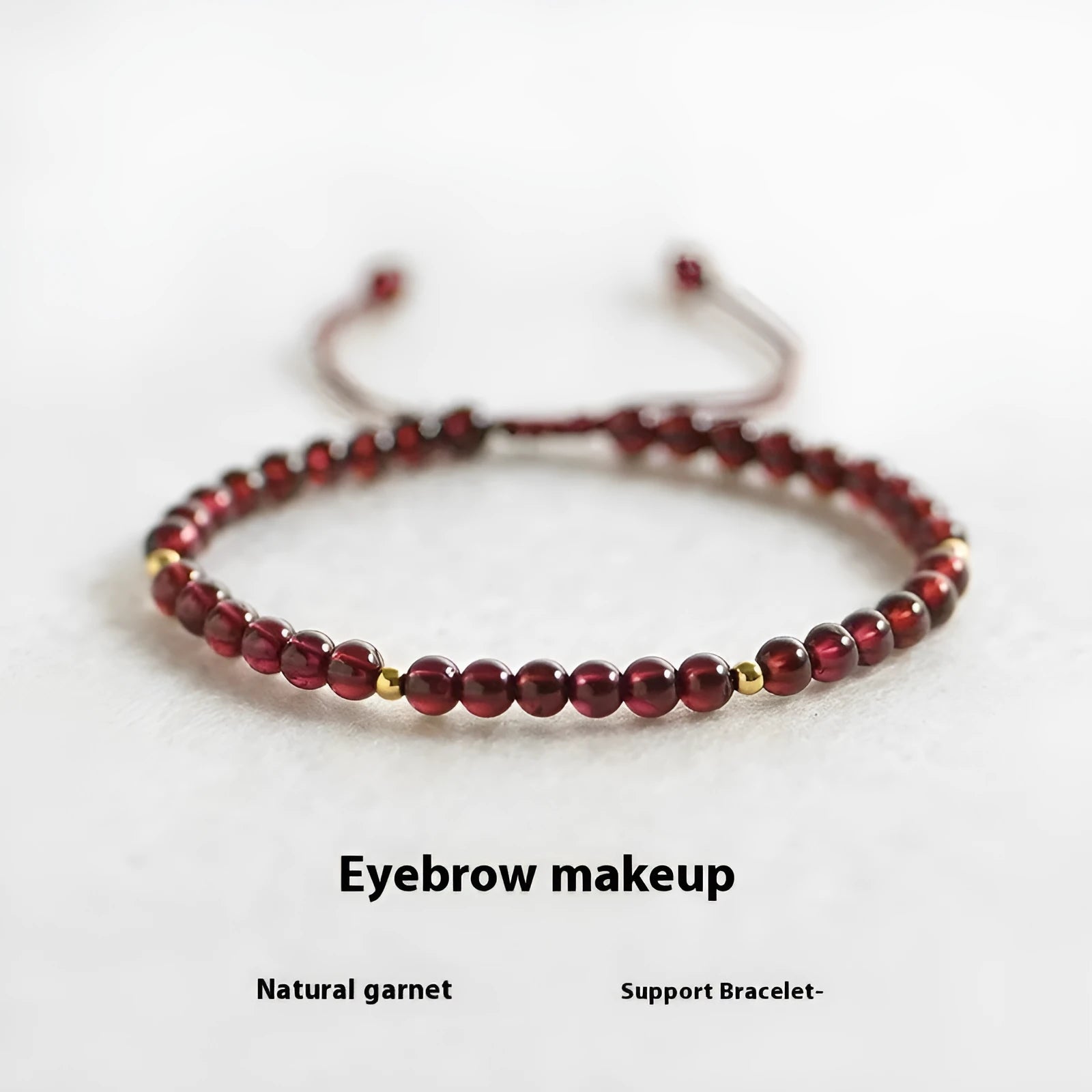 Hand-woven garnet red rope bracelet made from flexible wire, showing national tide style.