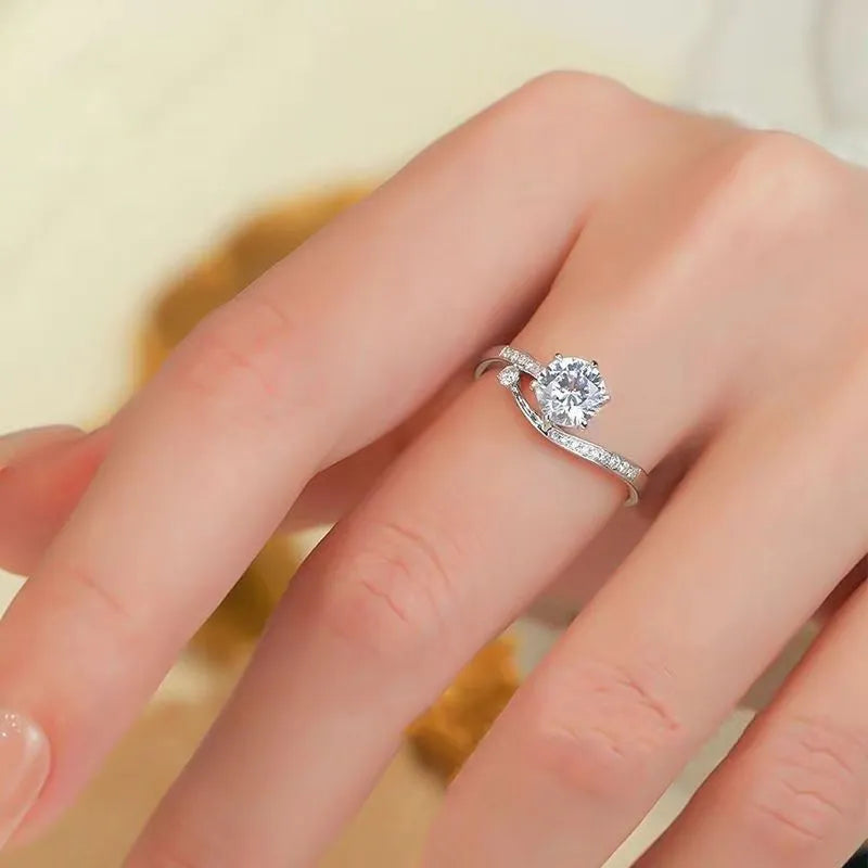 S925 sterling silver starry track ring with 1-karat oval plum blossom cut moissanite stone on white background