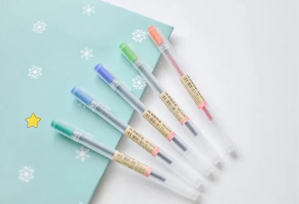 Pack of twelve black Muji gel pens with 0.5mm fine nibs, showing sleek barrel design