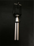 Black adjustable desktop phone holder with two-section metal bracket on a wooden desk
