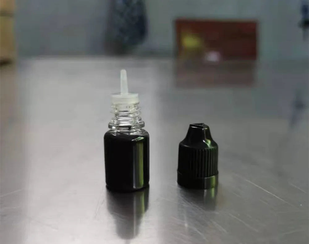 A small bottle containing 5ml of black confidentiality seal ink for privacy stamps.