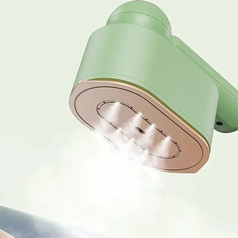 Green 800W portable garment steamer with foldable handle and titanium alloy panel, 70ml water fill, 1.6m cable, EU or UK plug.
