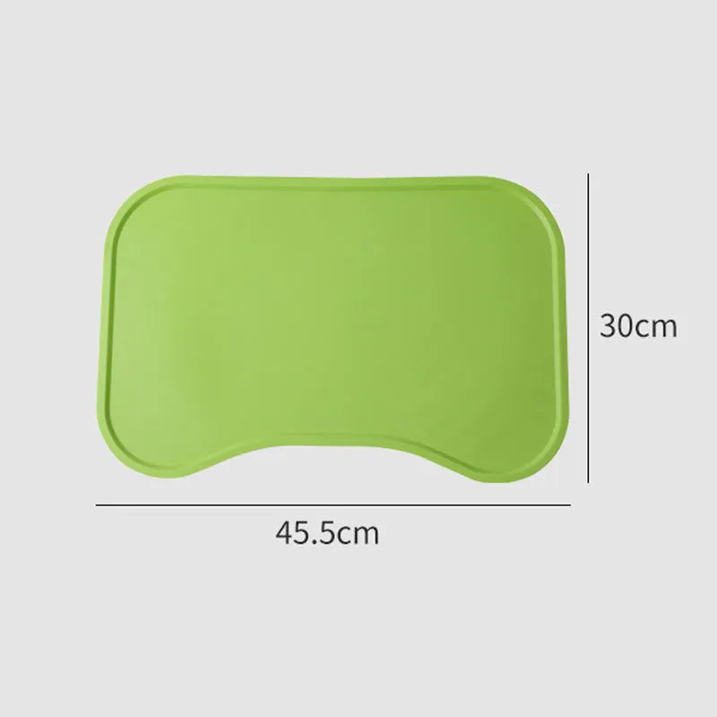 Waterproof silicone dog food mat with raised edges in green colour, non-slip base for pet bowls