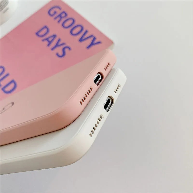 Silicone TPU phone case for Apple iPhone in various solid colours on a white background.