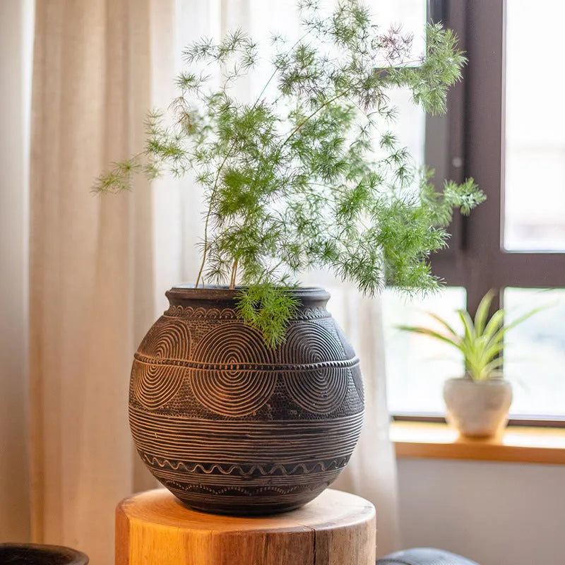 Medium cement flower pot with African ancient tank design and punched drainage base