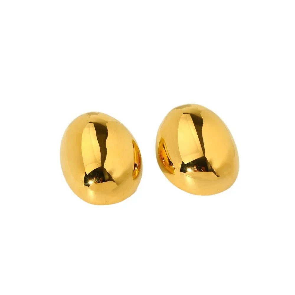 Geometric stainless steel ear studs with 18K gold plating and a glazed surface finish.