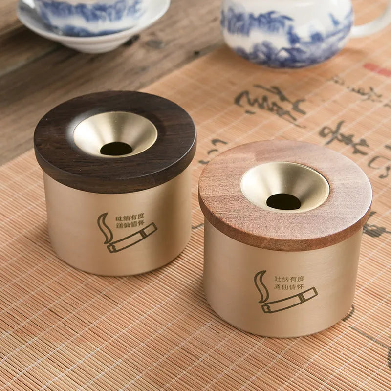 Retro brass ashtray with wooden lid in copper construction for living room use