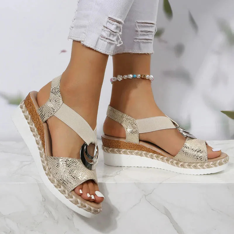 Women's peep toe serpentine wedge sandals, PU upper, in dark brown, shown on foot