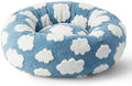 Round plaid dog bed with a raised edge on a plastic base, shown in a sea blue and white colour.