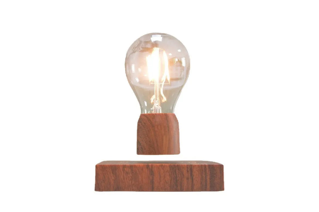 Magnetic levitation floating light bulb with imitation wood base.