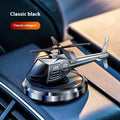 Silver metallic solar-powered helicopter car perfume ornament rotating on a car dashboard