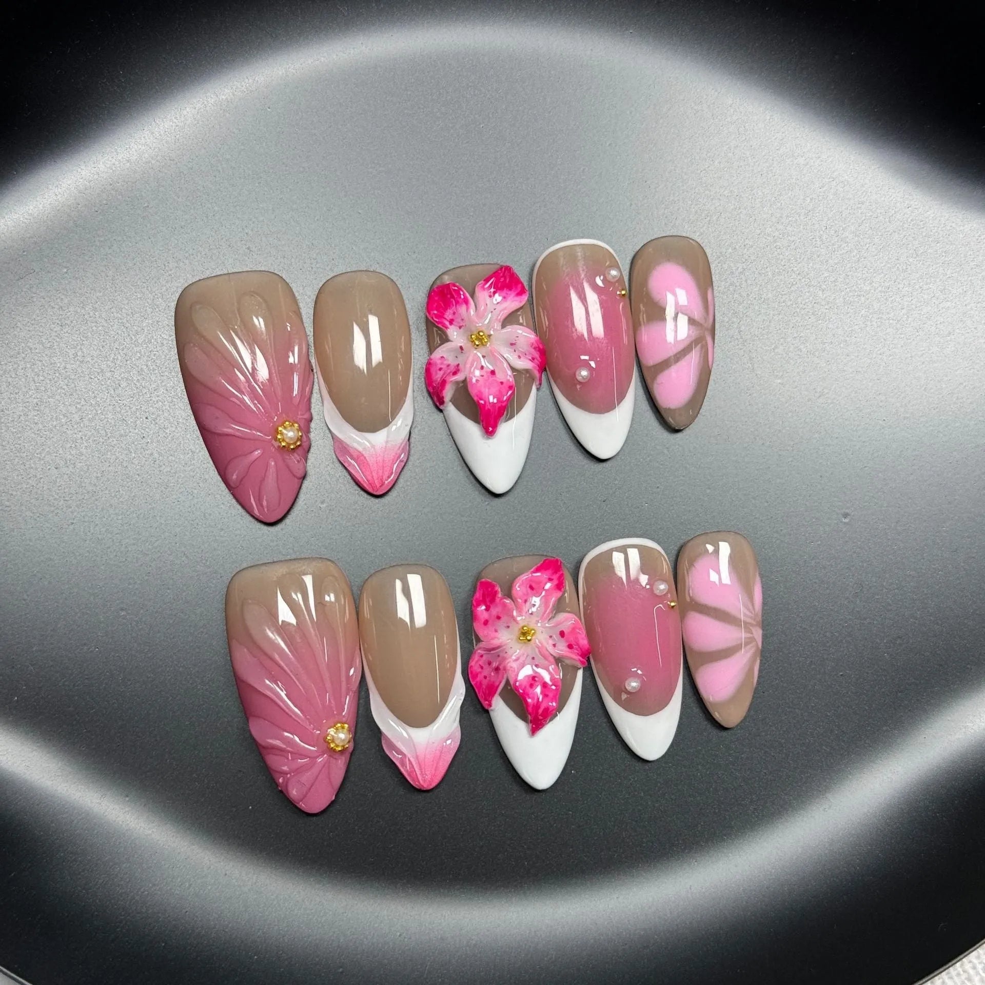 3D French style lily and ice flower plastic nail decoration in almond shape on a nail.