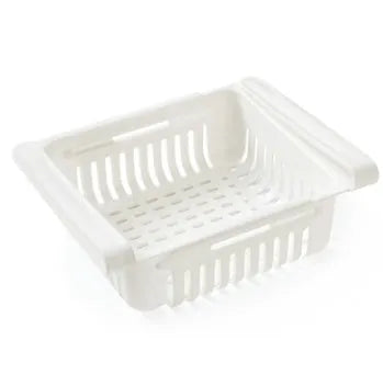 Blue telescopic plastic storage basket for refrigerator organisation with fruits and vegetables inside.