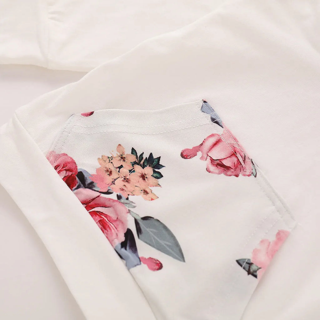 White cotton hooded tracksuit set for infant girl with long sleeves and trousers.