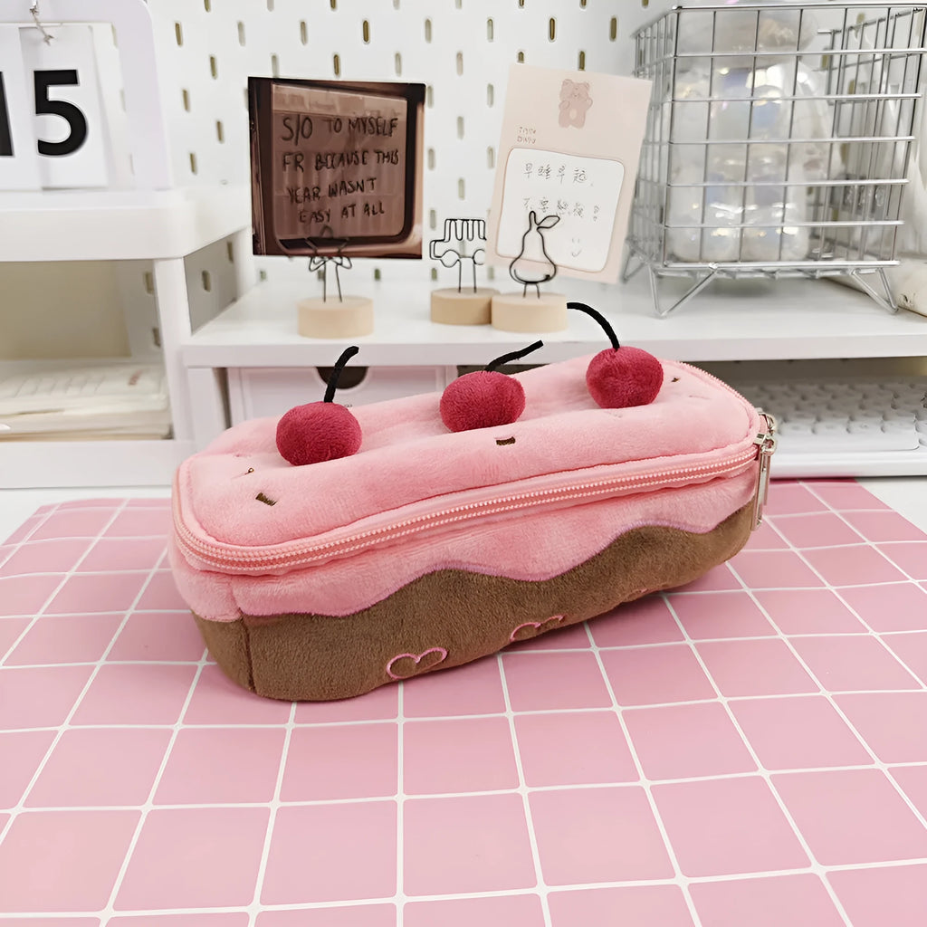 Cherry Cake plush velvet pencil bag with zip closure on a table.