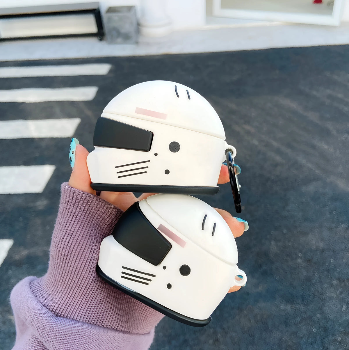 Silicone AirPods cover with motorcycle helmet shape, carabiner, and geometrical pattern, for AirPods Pro and AirPods 1/2.