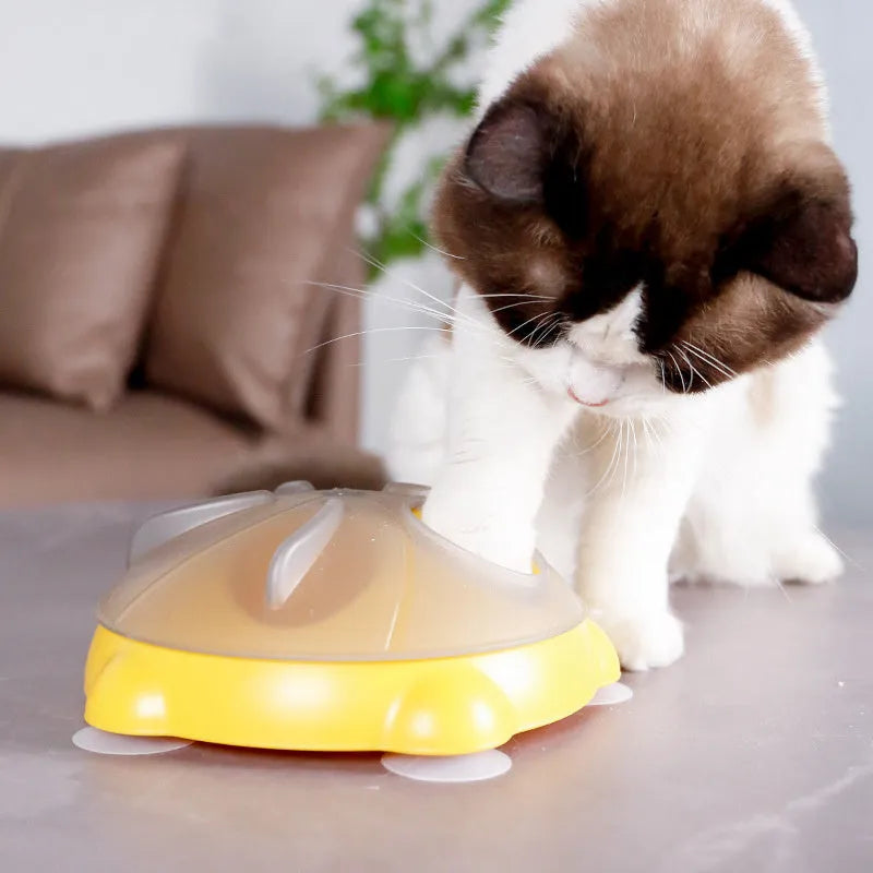Yellow educational cat toy with treat dispensing and snack storage functions