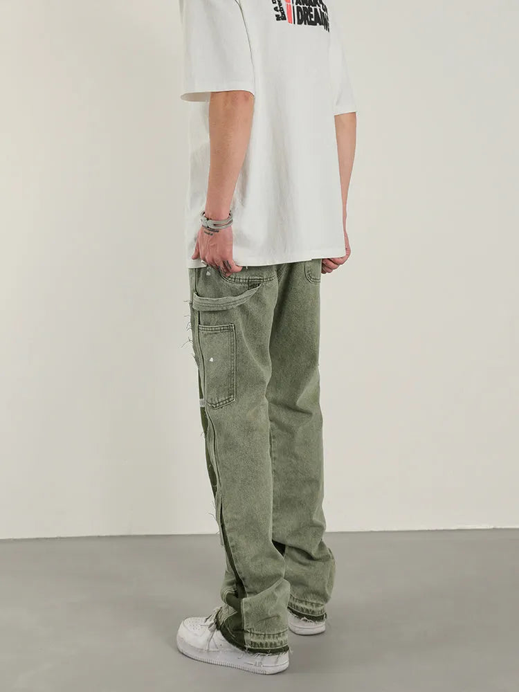 Men's heavy wash flared denim trousers in black green with multi-pocket and raw edge detailing