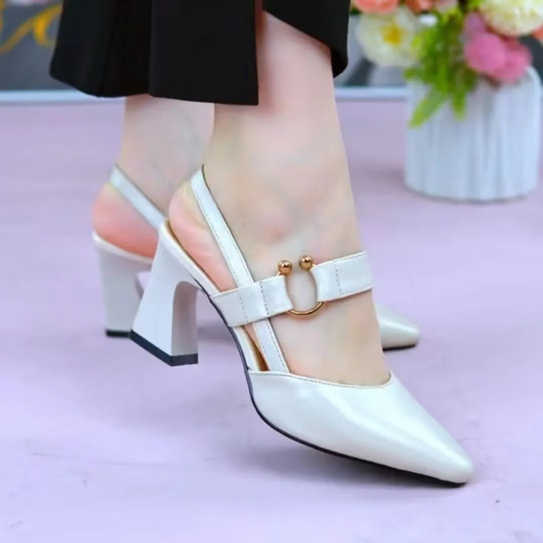 Women's apricot leather closed toe sandals with a chunky high heel and backless oversleeve design on a rubber sole.