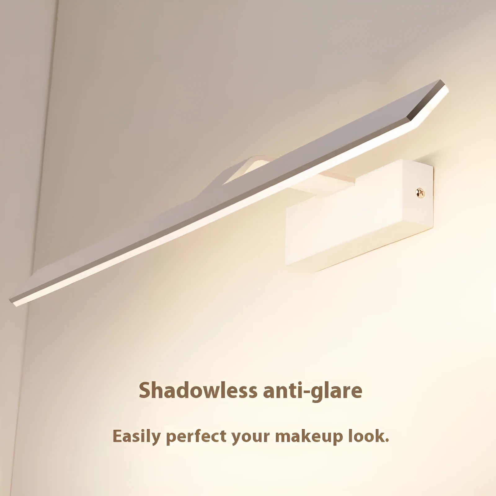 White LED bathroom mirror with tri-colour dimmable lighting mounted on a wall.