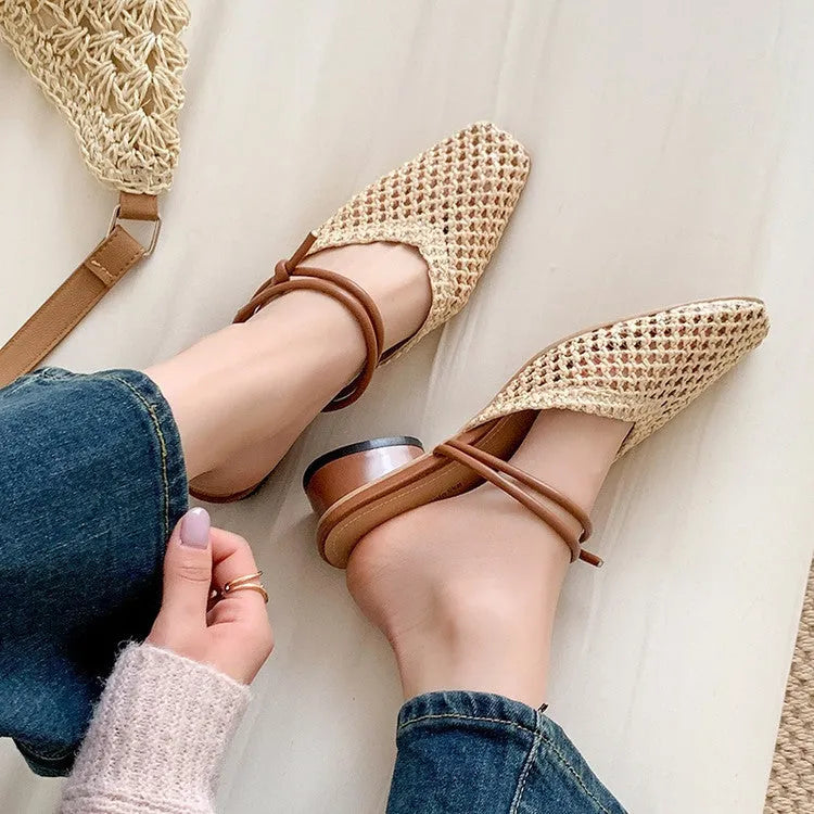 Women's beige square toe slippers with hollow-out design and a chunky mid-heel on a rubber sole.