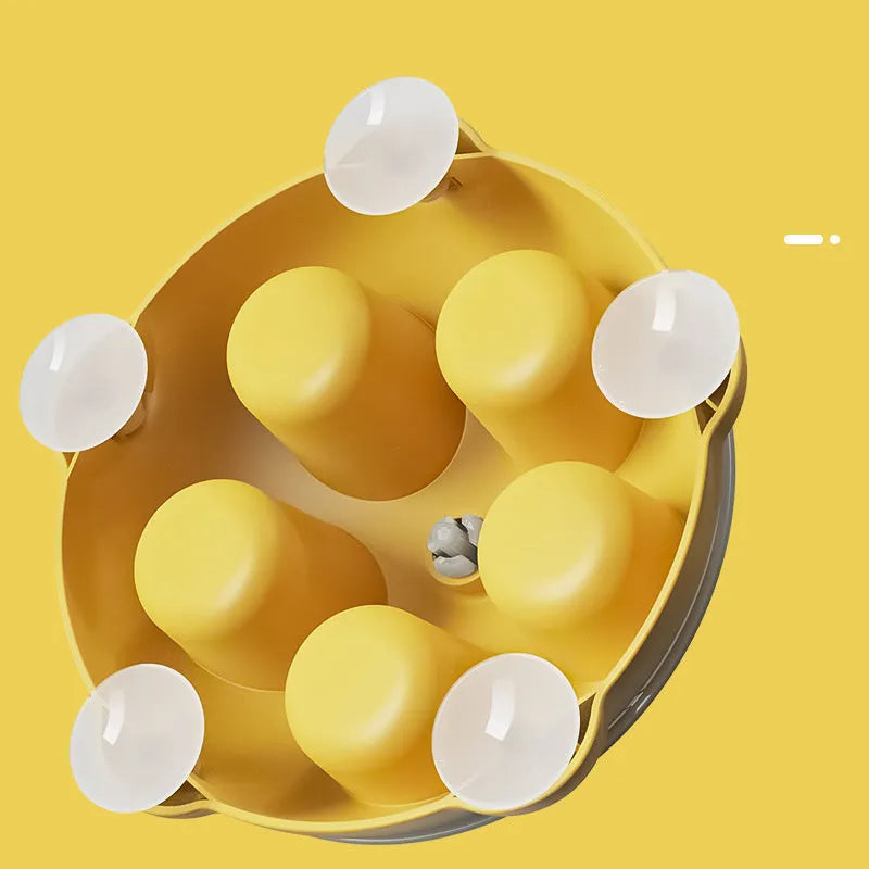 Yellow educational cat toy with treat dispensing and snack storage functions