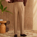 Men's slim fit straight leg trousers in light brown, laid flat.