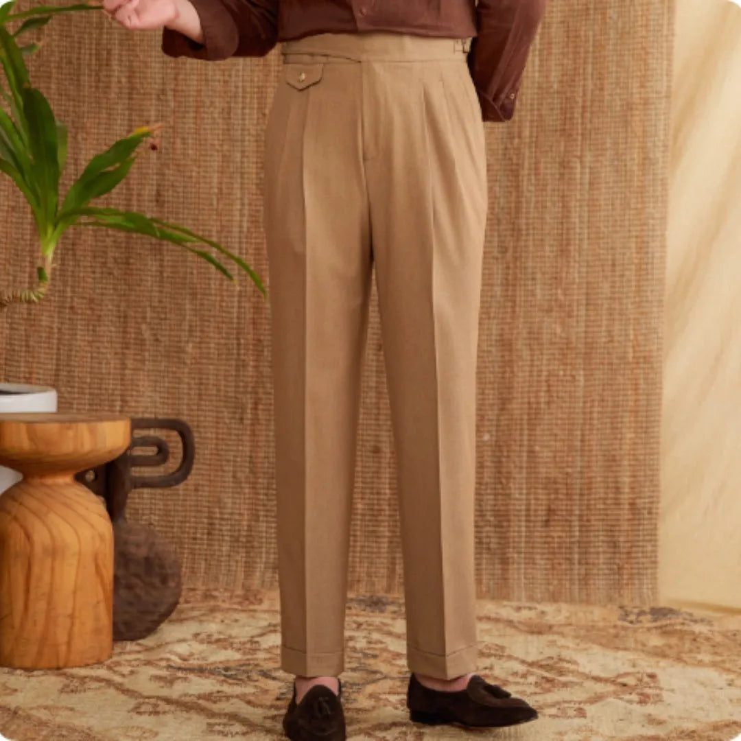 Men's slim fit straight leg trousers in light brown, laid flat.