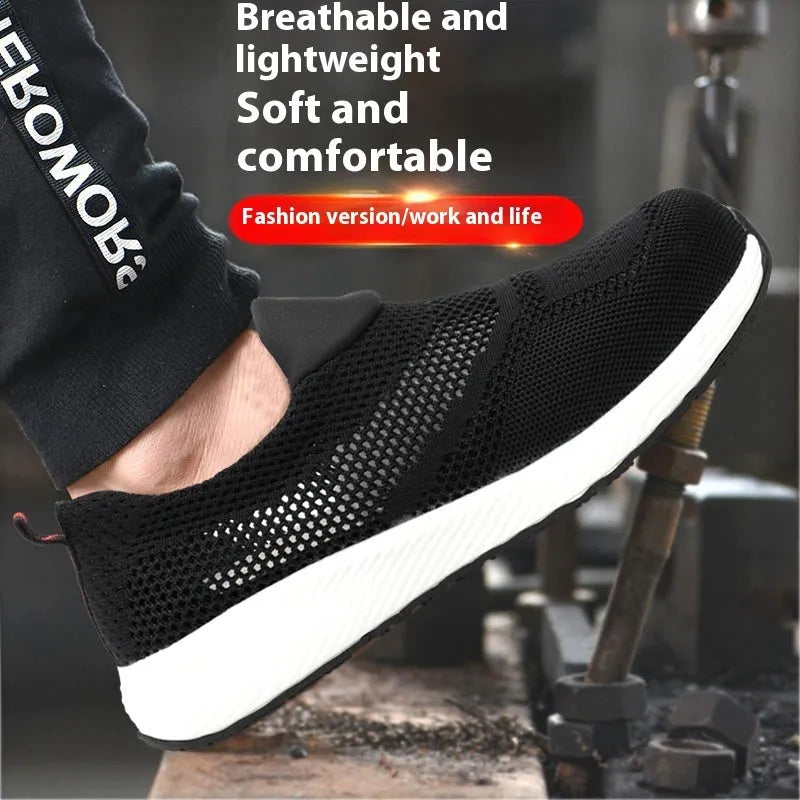 Men's black lightweight steel toe work safety shoe with mesh upper on grey background