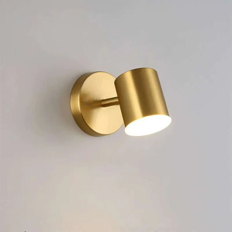 Rotatable bedside wall lamp with golden mirror front in gold finish mounted on wall