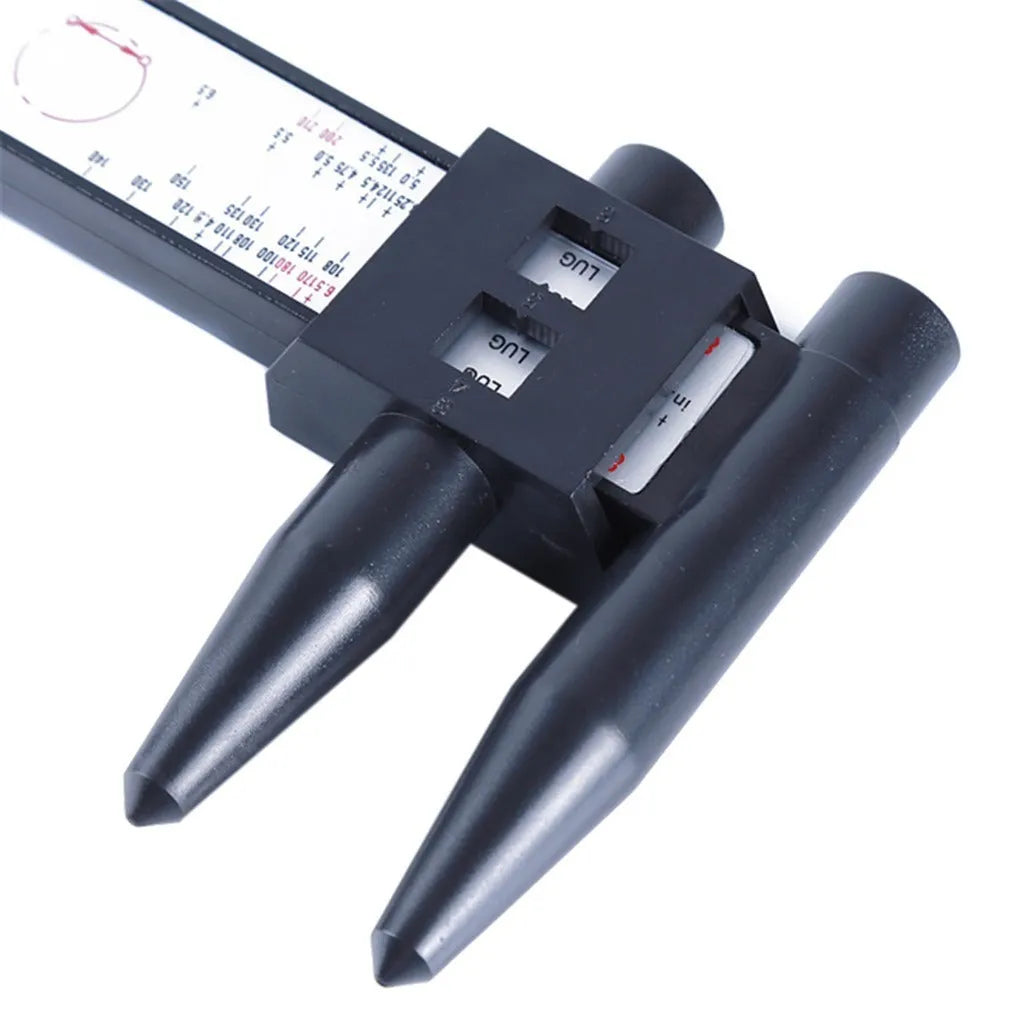 Plastic digital hole distance measuring ruler for wheel hub bolt patterns, showing digital display.