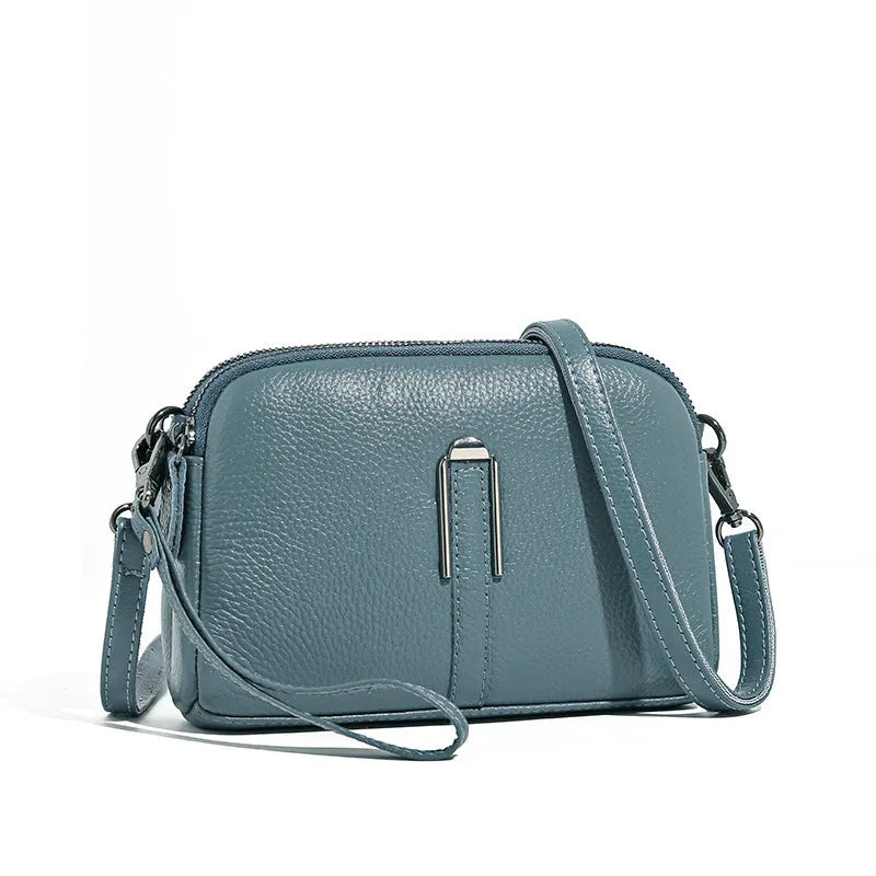 Top-grain leather crossbody bag with splicing design in khaki, horizontal shape, on model