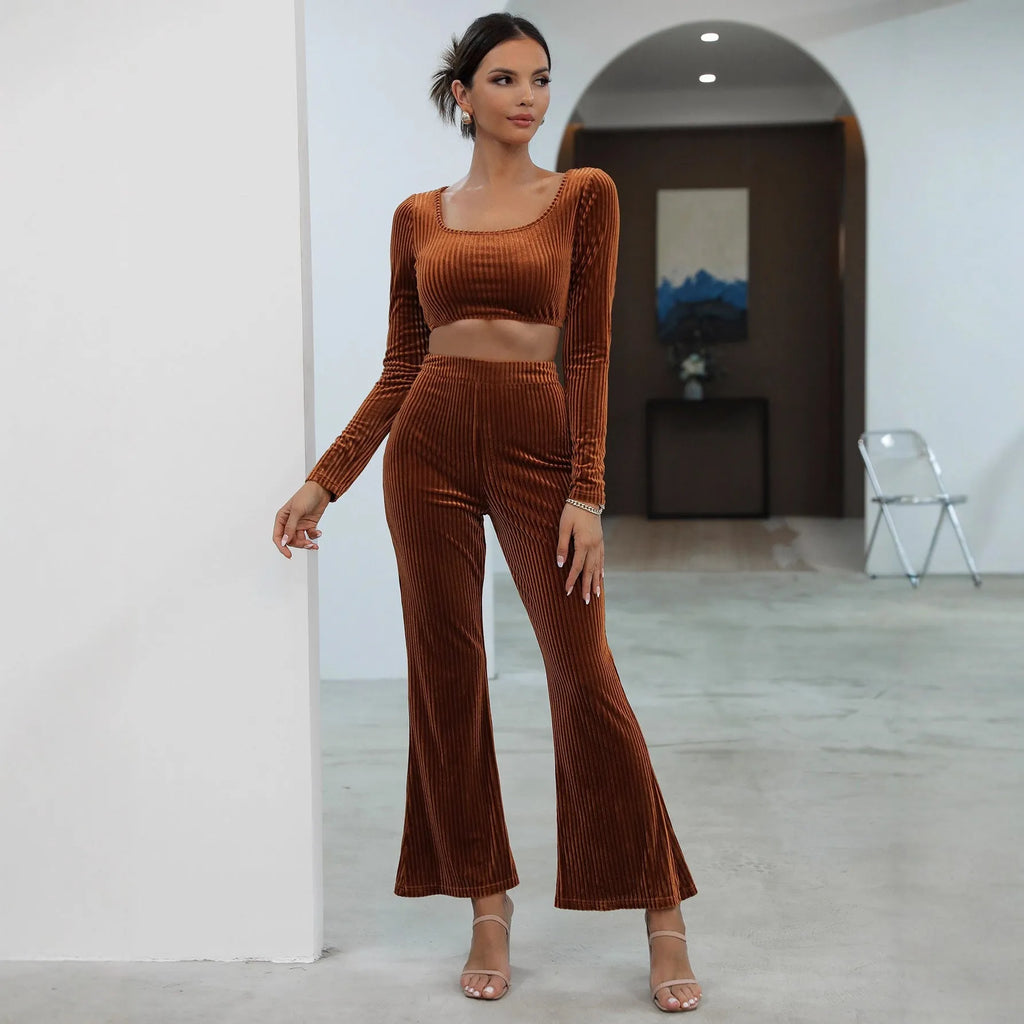 Caramel coloured long sleeve sweater and trouser set laid flat, showing casual two-piece design.