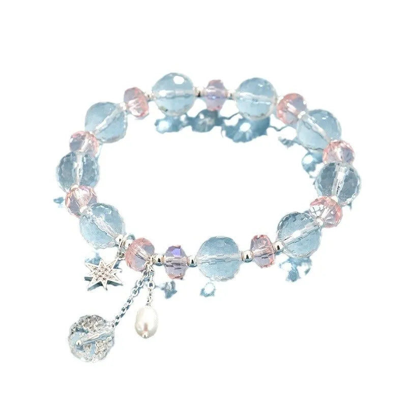 White crystal bracelet with lucky cat charm and diamond-shaped XINGX crystal centrepiece