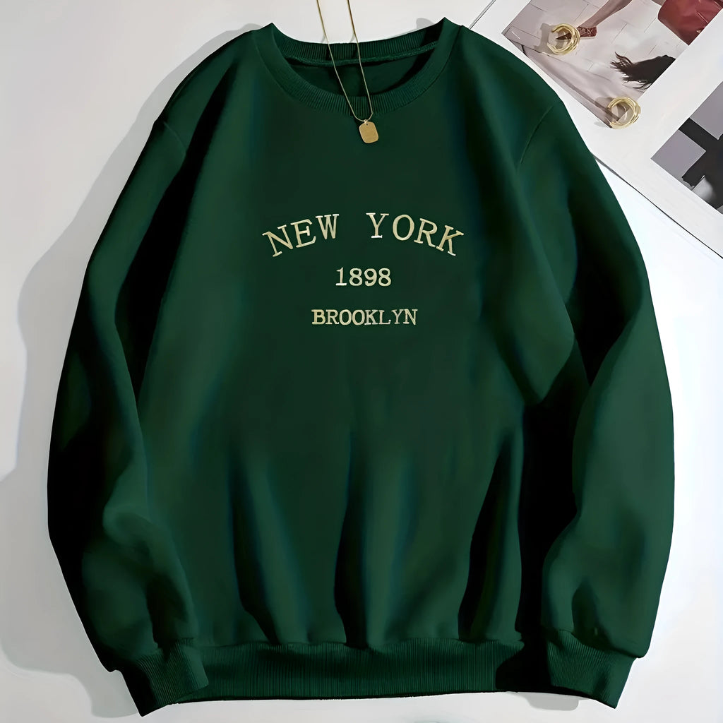 Loose round neck pullover top in green polyester with long sleeves, available in sizes XS to 5XL