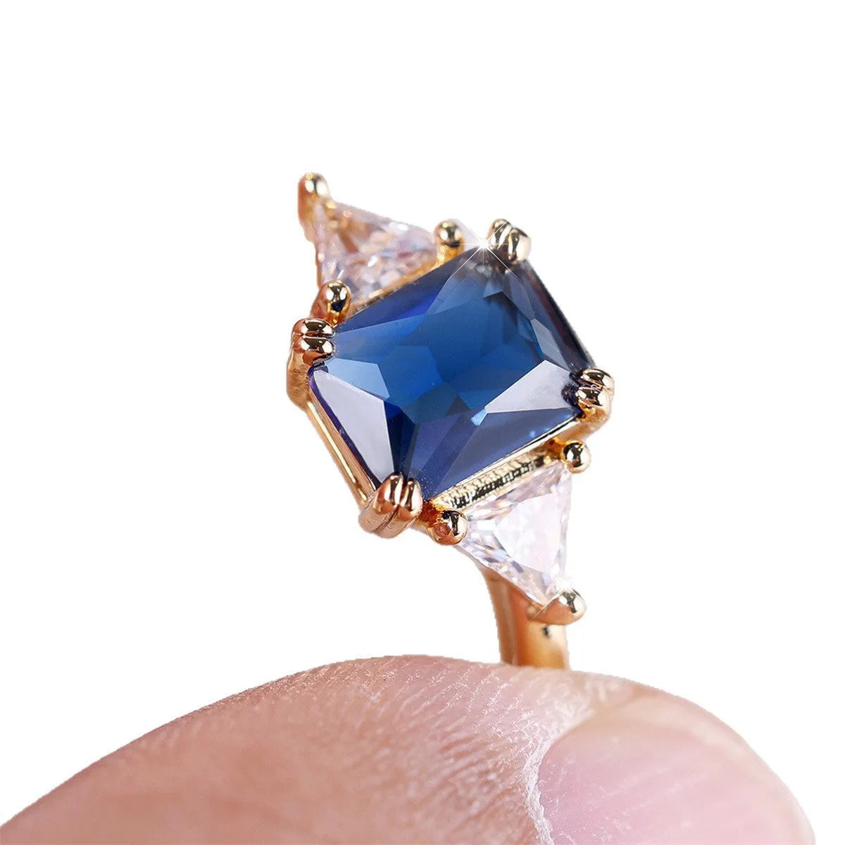 Rectangular gold sapphire blue copper ring for women showing geometric design