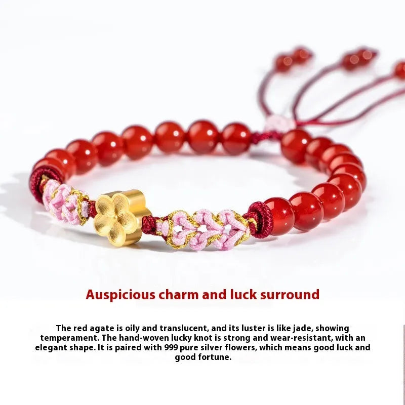 Hand-woven red rope bracelet with crystal centrepiece in Chinese peach blossom design