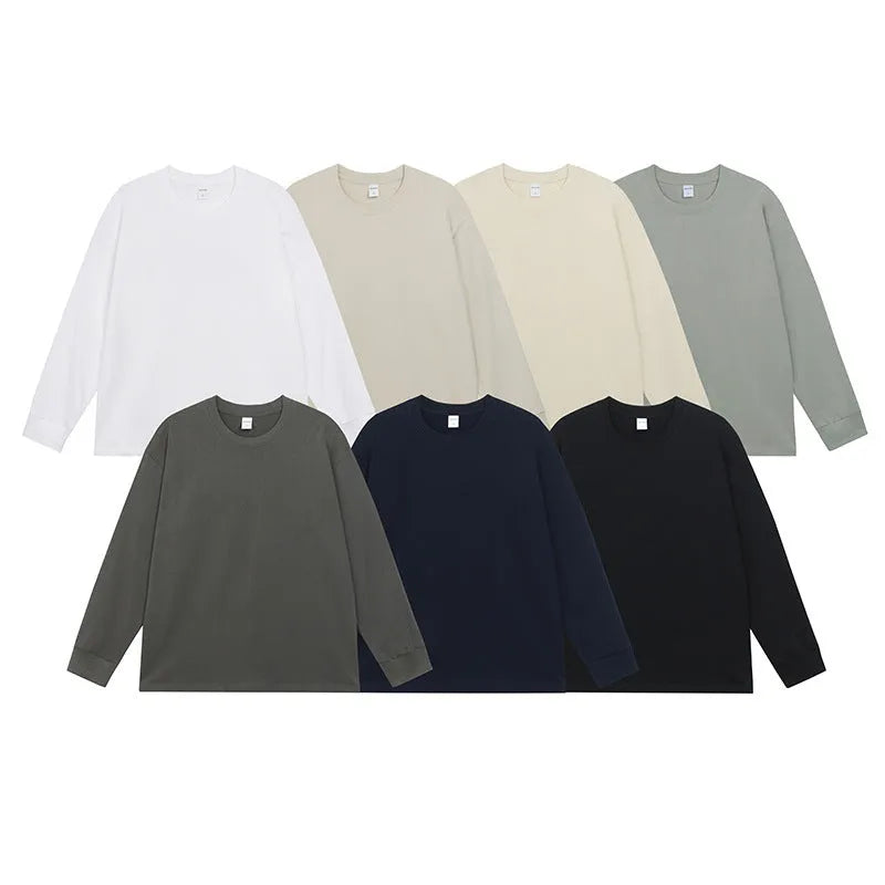 Men's solid colour pure cotton long-sleeved t-shirt shown in loose fit on a hanger.